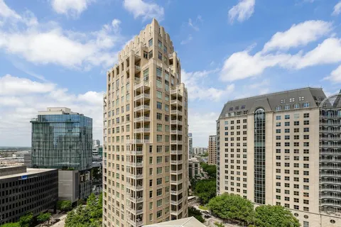 a view of a city with tall buildings