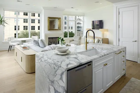 a kitchen with a sink stove and cabinets
