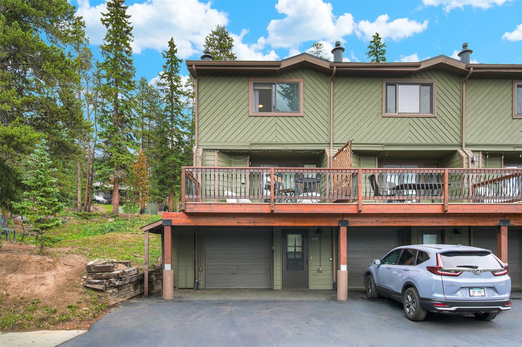 52 Club House Road, Unit 44 Breckenridge, CO 80424 - Photo 1 of 28 a front view of a house with a yard