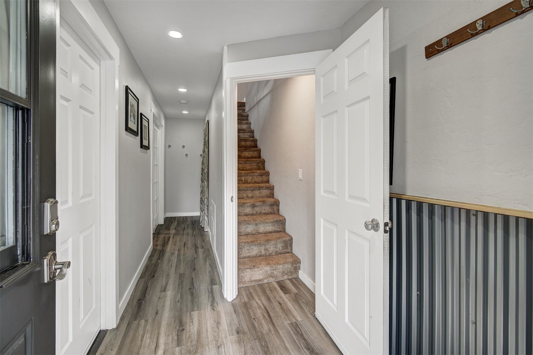 52 Club House Road, Unit 44 Breckenridge, CO 80424 - Photo 23 of 28 a view of a hallway with wooden floor and staircase