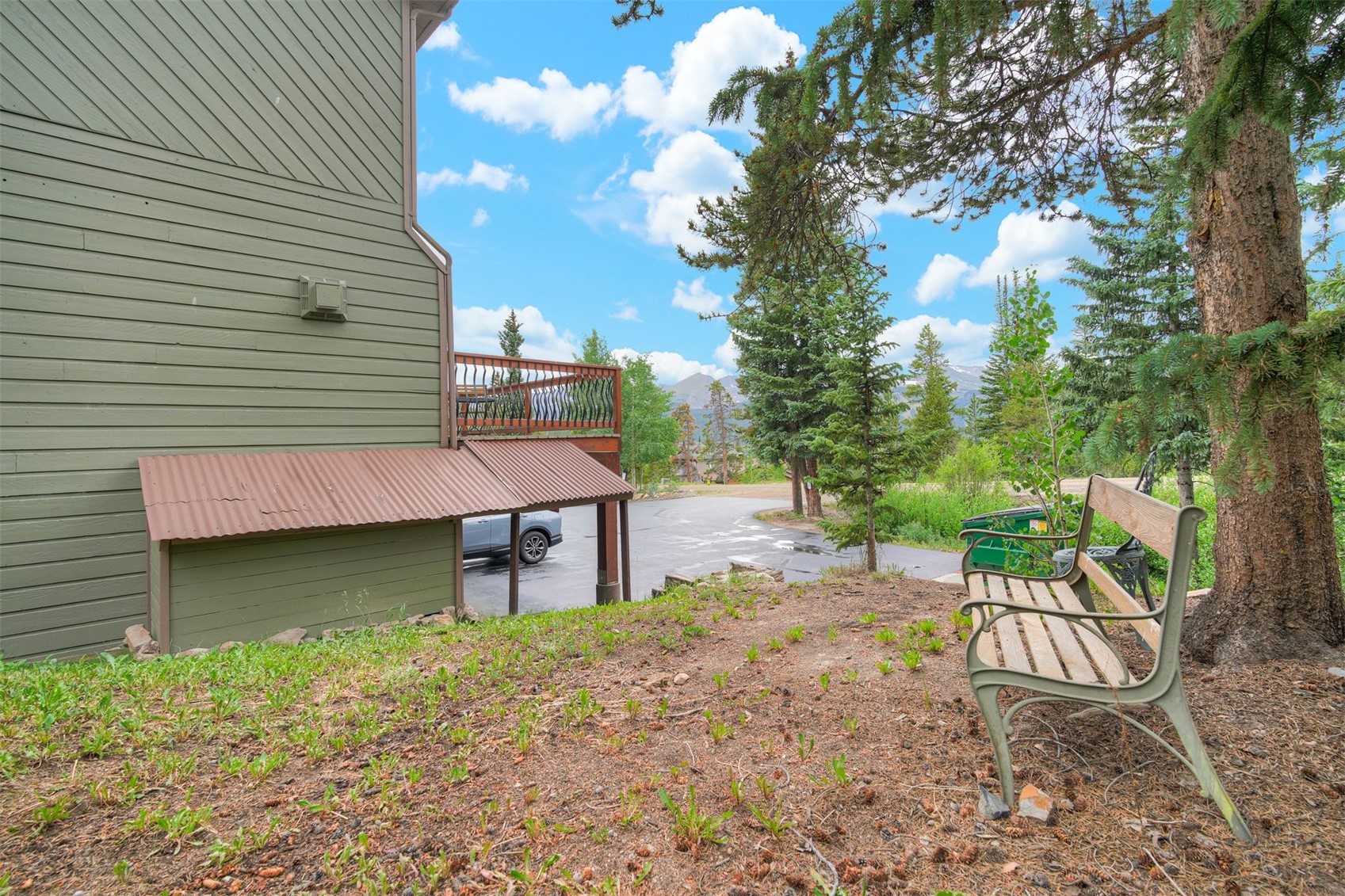 52 Club House Road, Unit 44 Breckenridge, CO 80424 - Photo 25 of 28 a view of a patio with table and chairs with wooden fence and plants