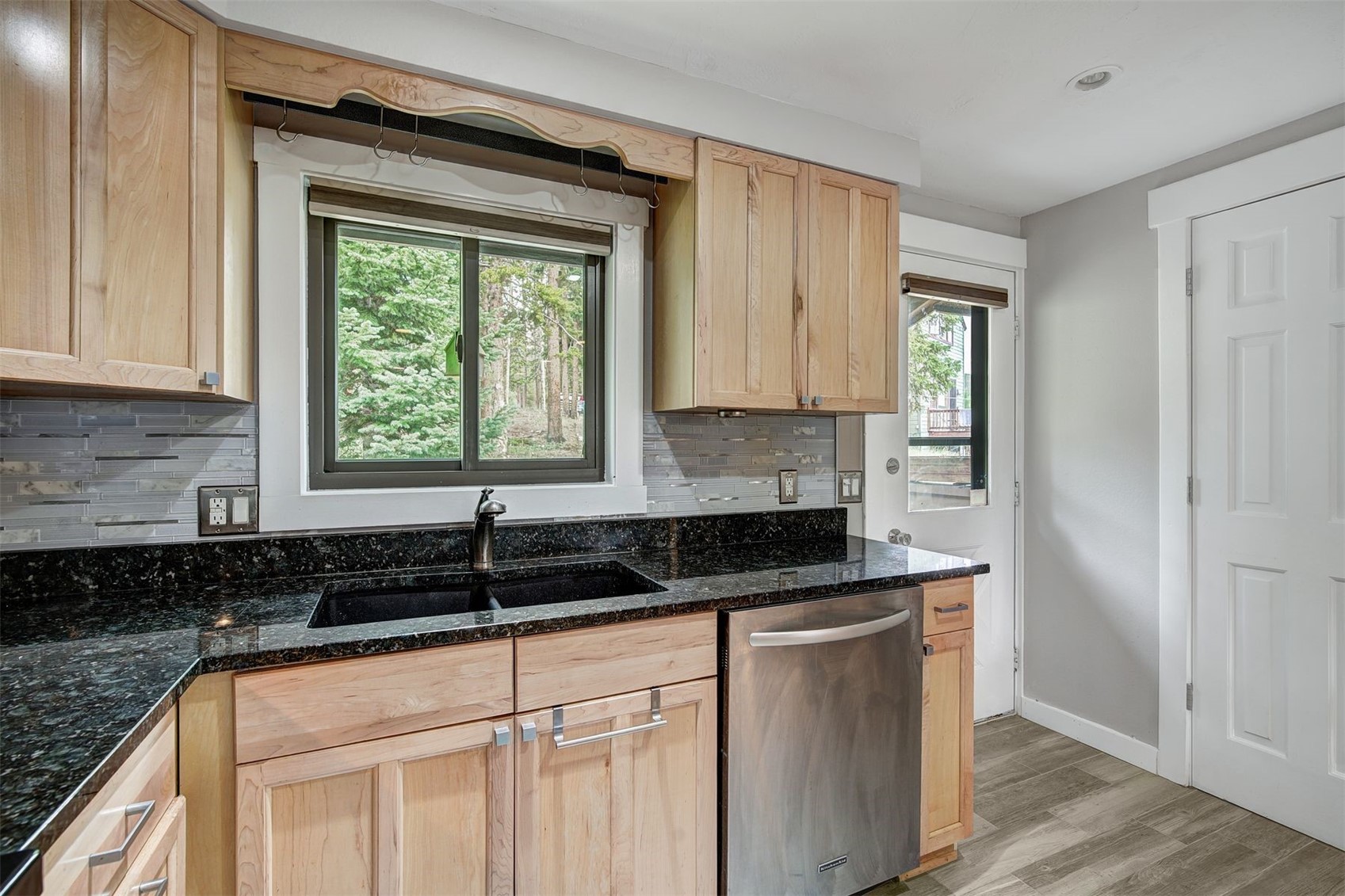 52 Club House Road, Unit 44 Breckenridge, CO 80424 - Photo 4 of 28 a kitchen with granite countertop a sink window and cabinets