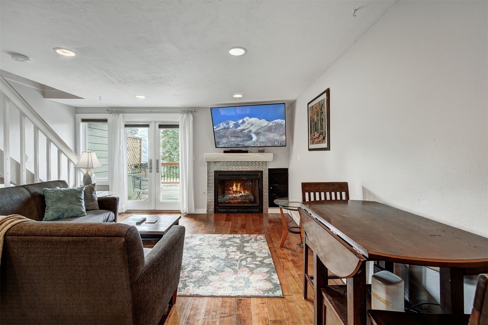 52 Club House Road, Unit 44 Breckenridge, CO 80424 - Photo 7 of 28 a living room with furniture and a fireplace