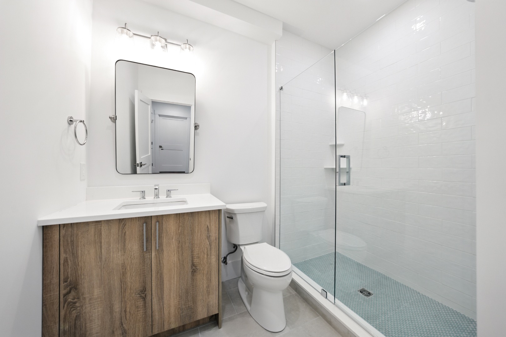 10 Beach Grass Road Nantucket, MA 02554 - Photo 19 of 29 a bathroom with a toilet a sink a vanity and mirror