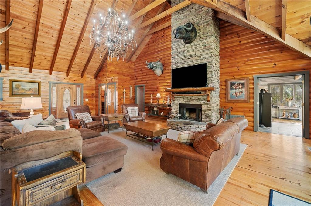 665 Little Refuge Road Waleska, GA 30183 - Photo 18 of 73 a living room with furniture large window and a fireplace