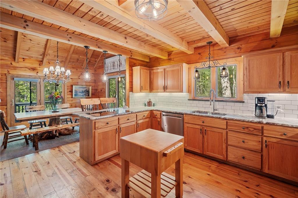 665 Little Refuge Road Waleska, GA 30183 - Photo 37 of 73 a kitchen with a sink stove and cabinets