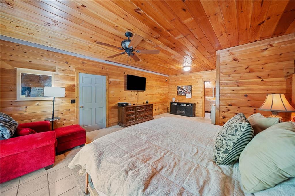 665 Little Refuge Road Waleska, GA 30183 - Photo 54 of 73 a bedroom with a bed and wooden floor