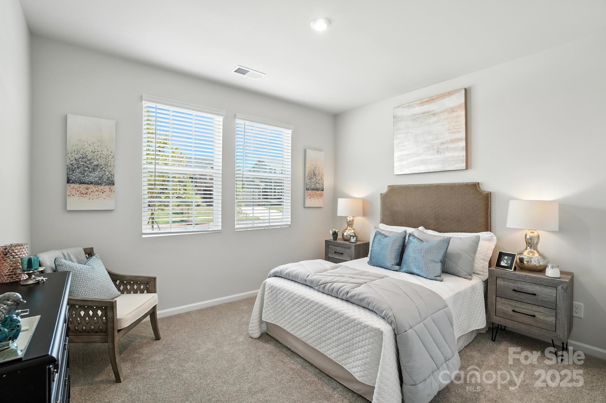 1217 Roscoe Court Monroe, NC 28112 - Photo 19 of 46 a bedroom with a bed and a window