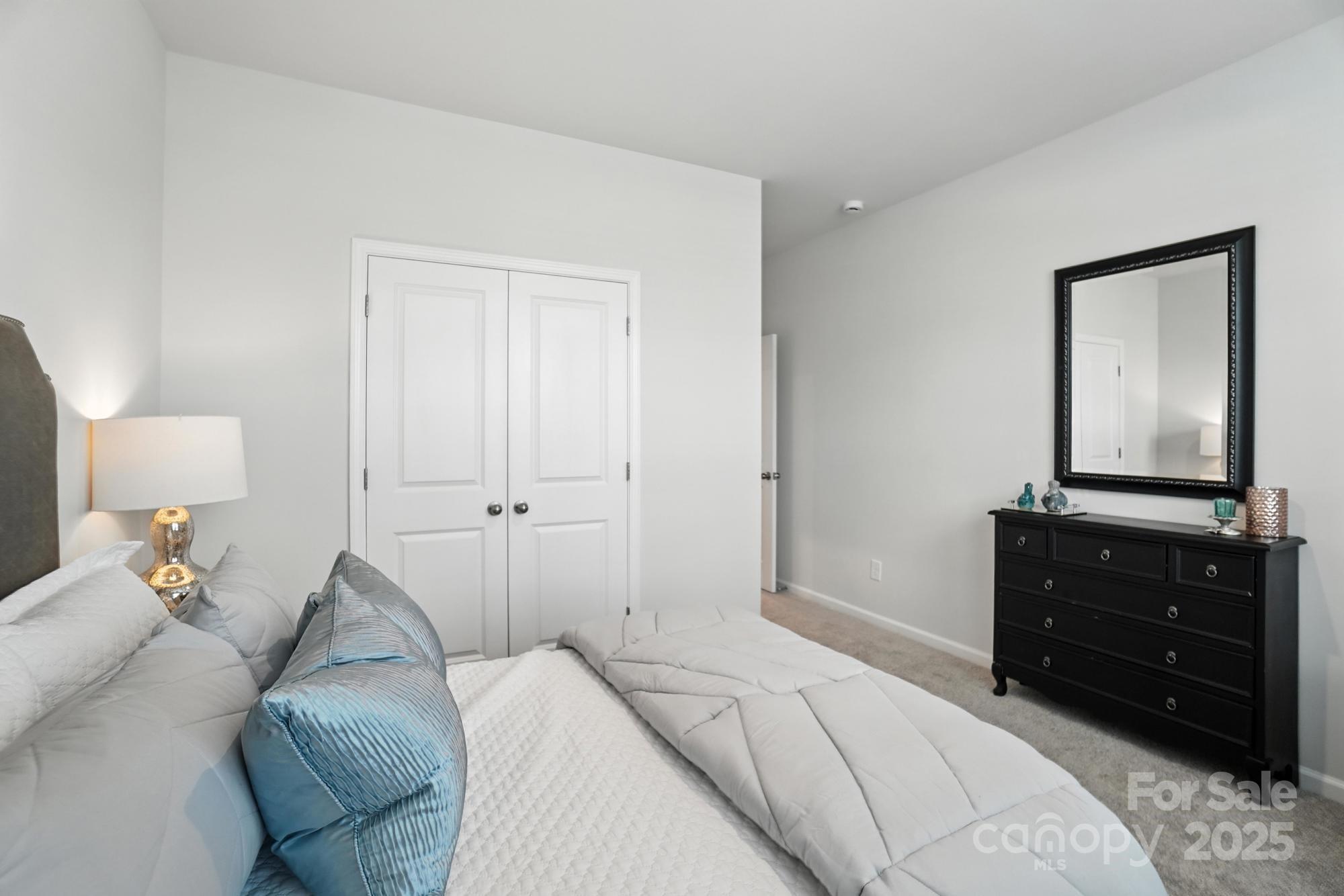1217 Roscoe Court Monroe, NC 28112 - Photo 21 of 46 a bed room with a bed and a television