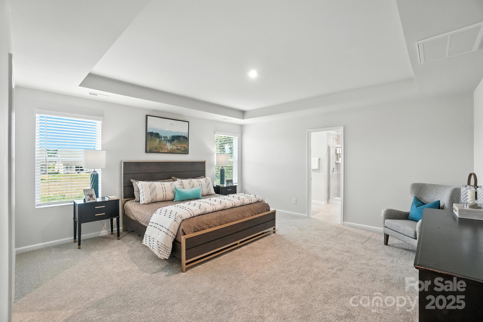 1217 Roscoe Court Monroe, NC 28112 - Photo 28 of 46 a bedroom with a bed lamp and a large window