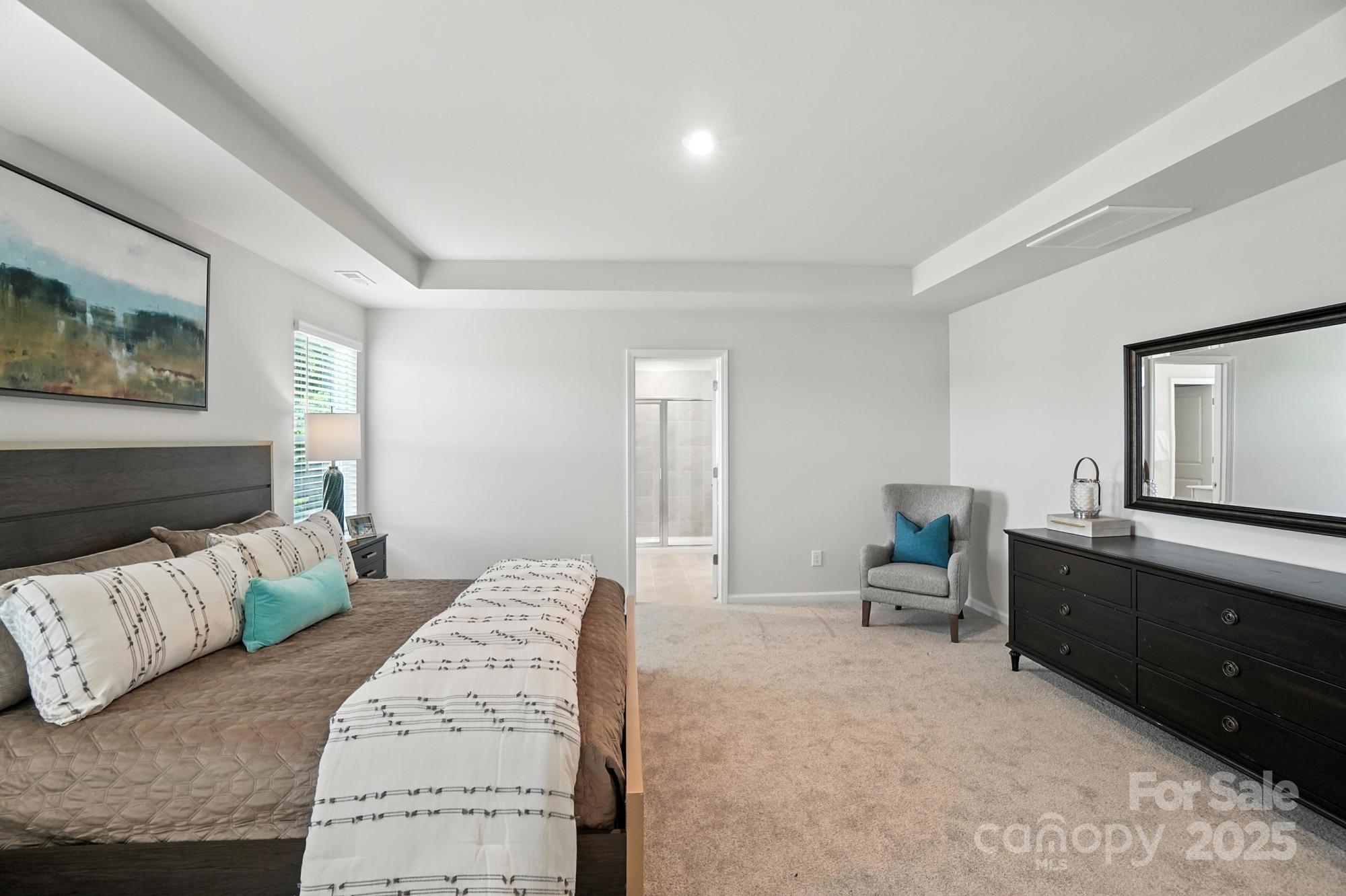1217 Roscoe Court Monroe, NC 28112 - Photo 31 of 46 a spacious bedroom with a bed and furniture