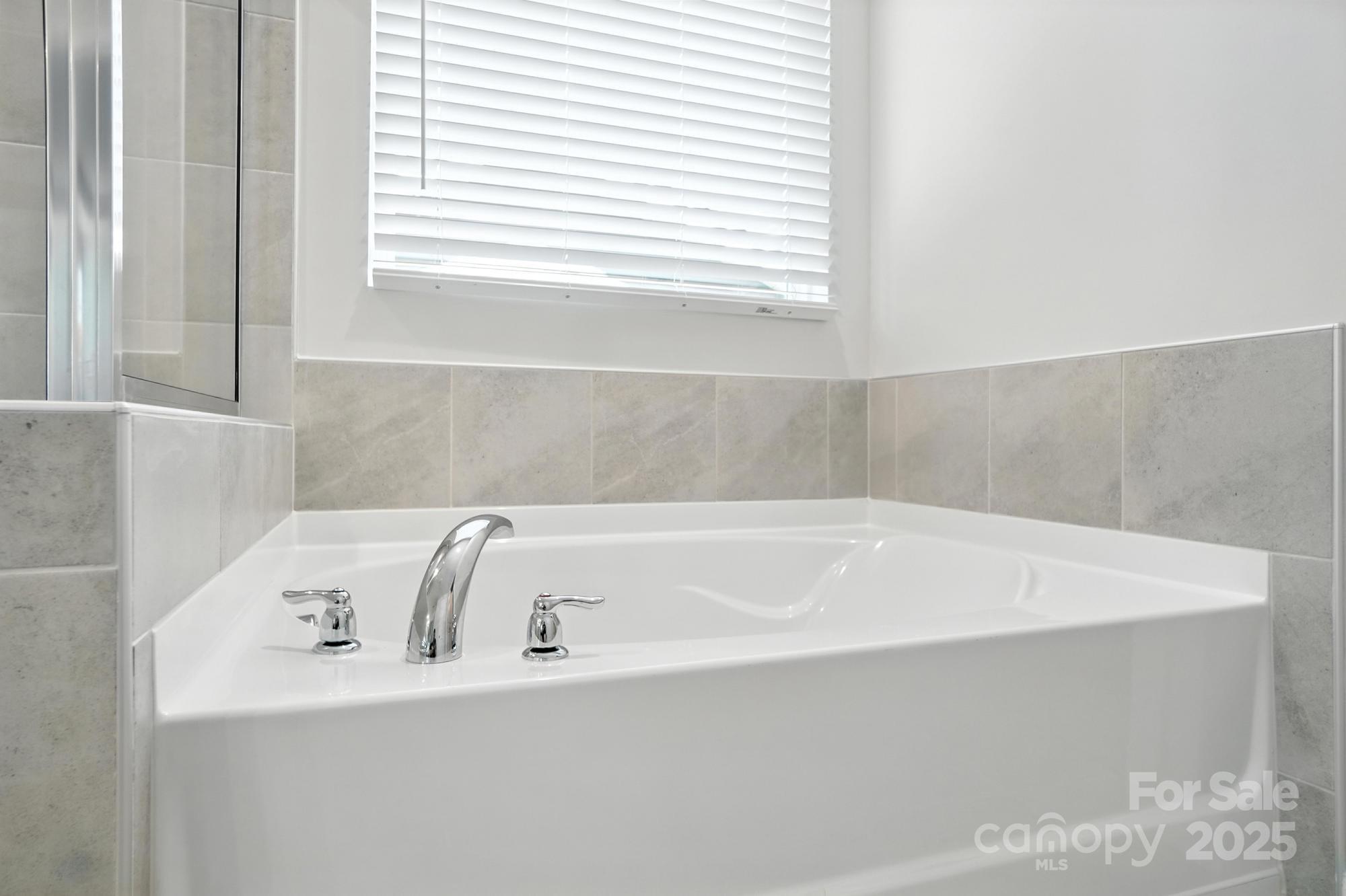 1217 Roscoe Court Monroe, NC 28112 - Photo 35 of 46 a bathroom with a bathtub