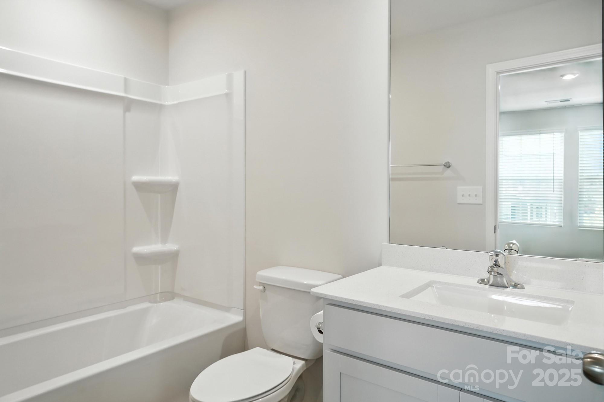 1217 Roscoe Court Monroe, NC 28112 - Photo 45 of 46 a bathroom with a sink toilet and bathtub