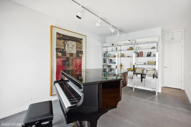 a view of a hallway with chairs