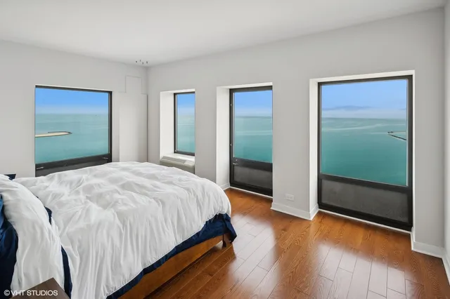 a bedroom with a bed and a glass door