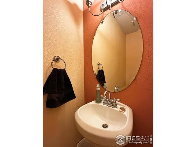 a bathroom with a sink and mirror