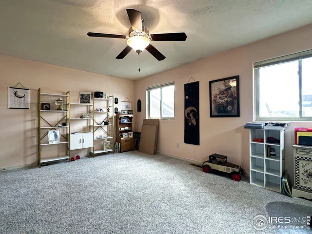 a view of a livingroom with furniture and windows