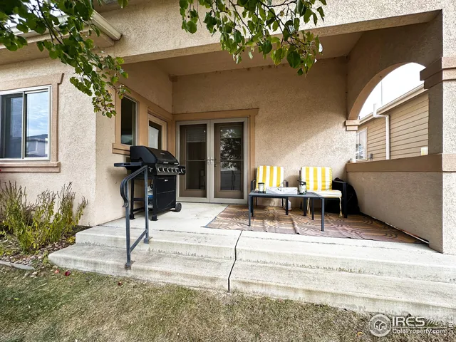 a view of living room filled with furniture and a potted plant