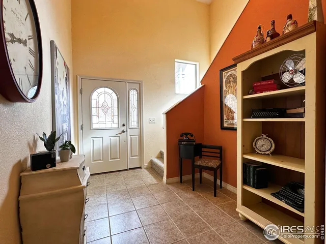a view of a livingroom with furniture and a fireplace