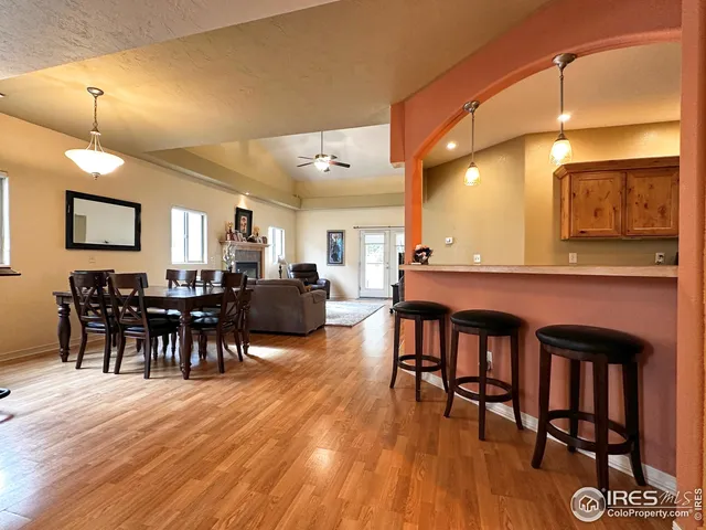 a large room with furniture and wooden floor