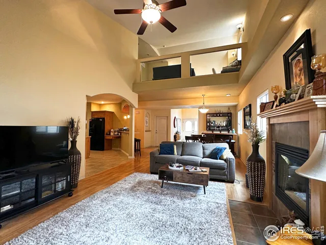 a living room with fireplace furniture and a flat screen tv