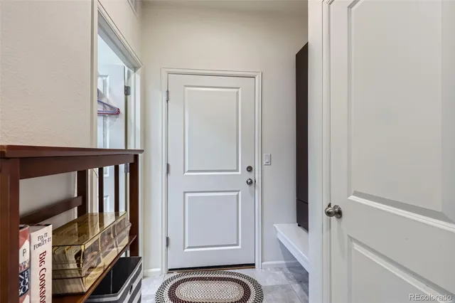 a view of an entryway with wooden floor