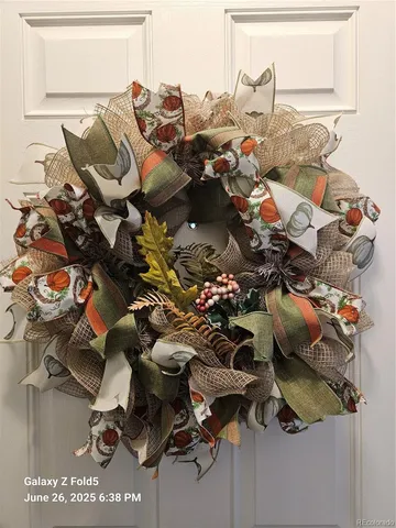 a picture of a room with water heater and wooden floor