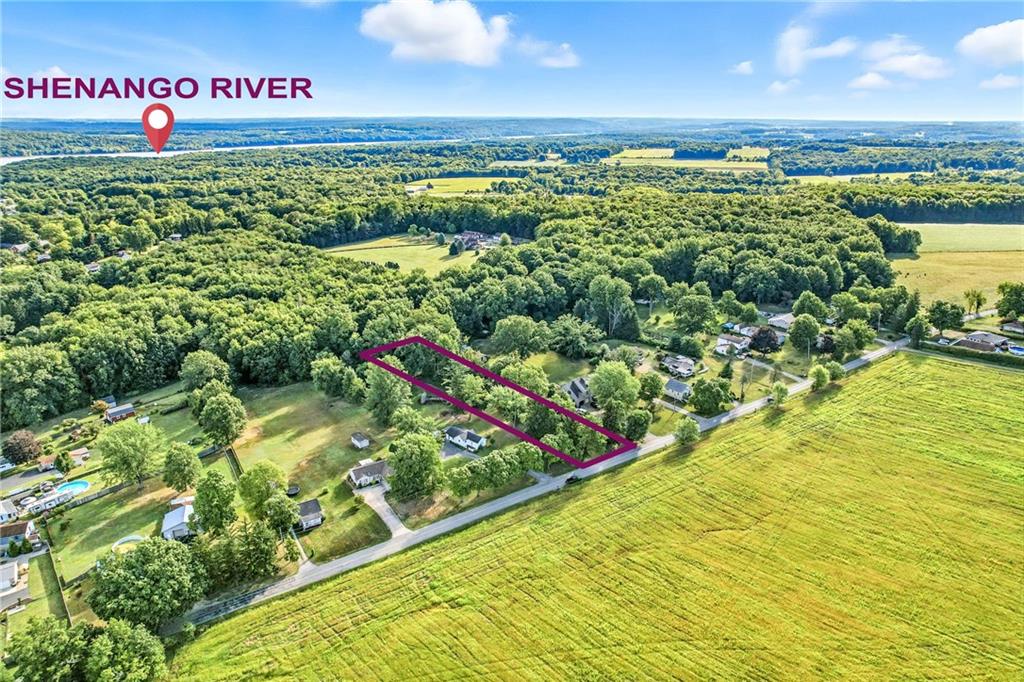 2766 Robertson Road Sharpsville, PA 16150 - Photo 2 of 6 a view of a lake with a big yard