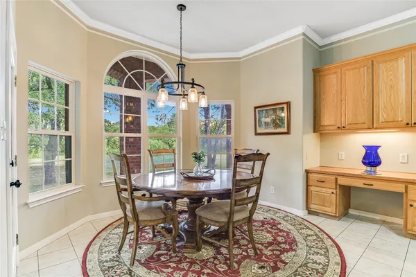 a kitchen with stainless steel appliances granite countertop a sink refrigerator and cabinets