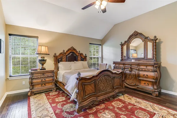 a living room with furniture and a bookshelf