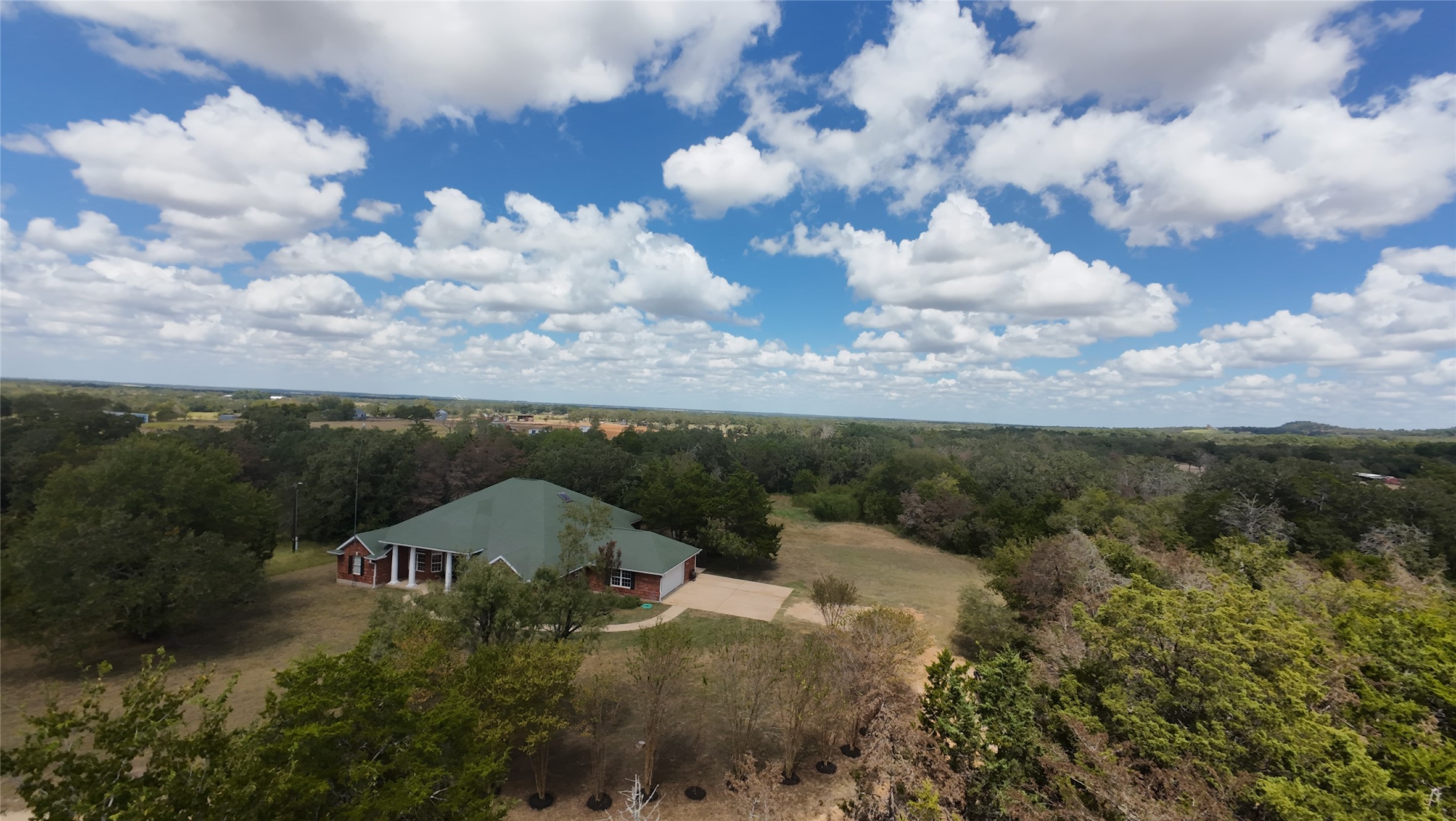 741 Knobbs Road McDade, TX 78650 - Photo 29 of 37 an aerial view of a house with yard and mountain view in back