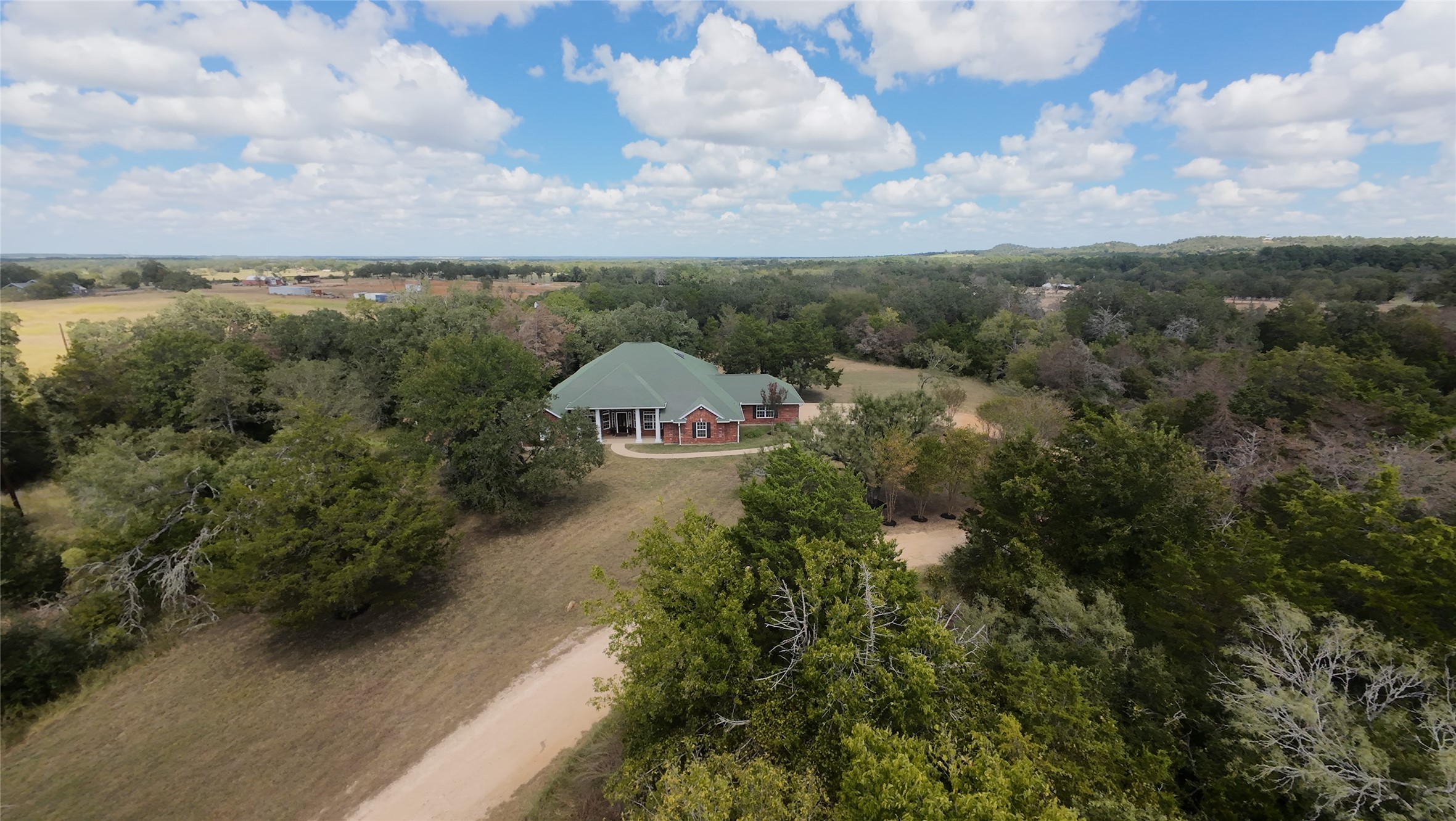 741 Knobbs Road McDade, TX 78650 - Photo 3 of 37 a view of a house with a yard and lake view