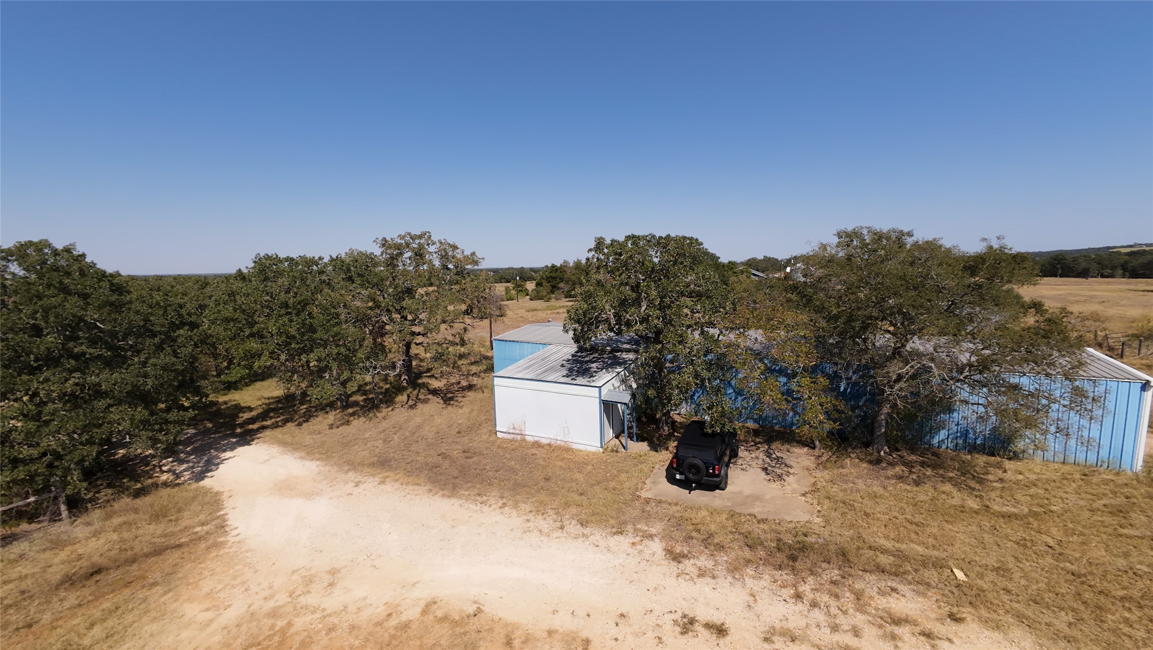 741 Knobbs Road McDade, TX 78650 - Photo 32 of 37 a road view of a house with a yard
