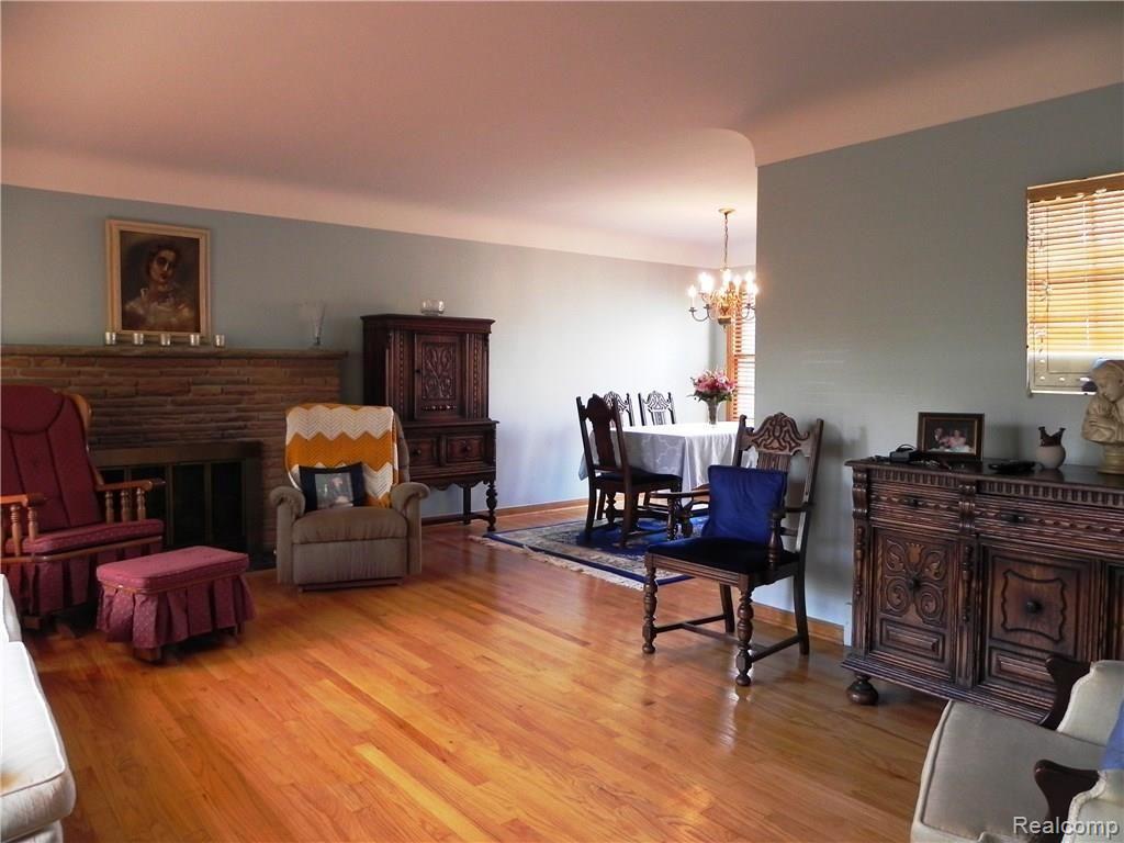 1297 East Maple Road Birmingham, MI 48009 - Photo 7 of 32 LIVING ROOM WITH FIREPLACE - OPEN TO DINING RM