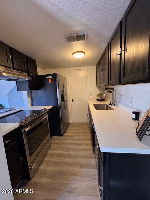 3221 West Royal Palm Road Phoenix, AZ 85051 - Photo 11 of 23 a kitchen with a stove a refrigerator and a sink