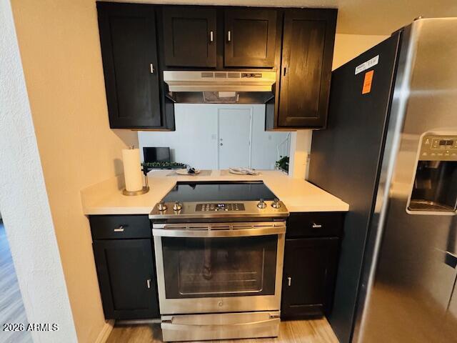 3221 West Royal Palm Road Phoenix, AZ 85051 - Photo 13 of 23 a kitchen with a stove microwave and sink