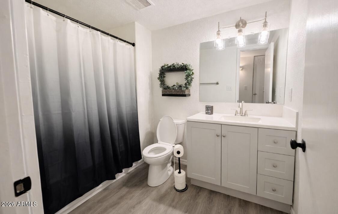 3221 West Royal Palm Road Phoenix, AZ 85051 - Photo 17 of 23 a bathroom with a sink a toilet and shower