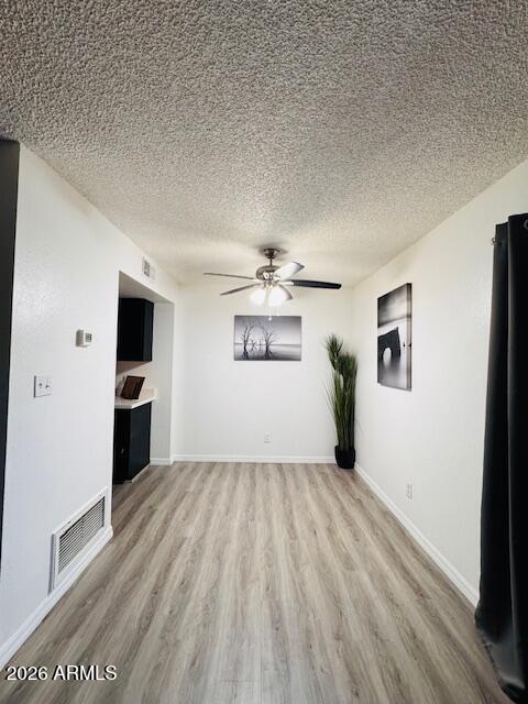 3221 West Royal Palm Road Phoenix, AZ 85051 - Photo 6 of 23 wooden floor in an empty room with a window