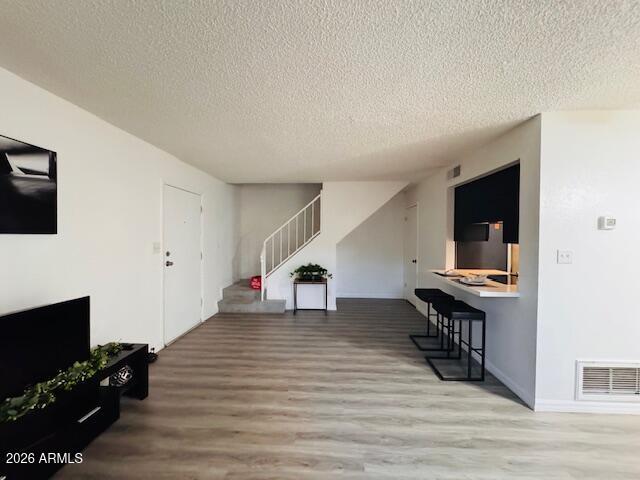 3221 West Royal Palm Road Phoenix, AZ 85051 - Photo 9 of 23 a view of a livingroom with wooden floor and furniture