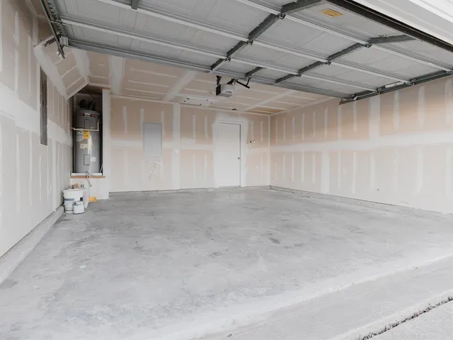 an empty room with a ceiling fan