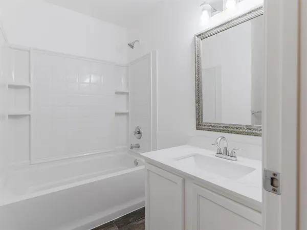 a bathroom with a sink and a bathtub