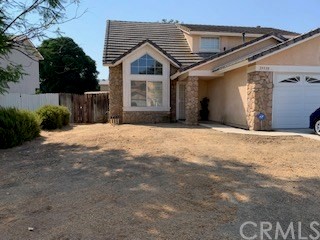 29538 Catano Road Menifee, CA 92584 - Photo 1 of 1 a front view of a house with a yard