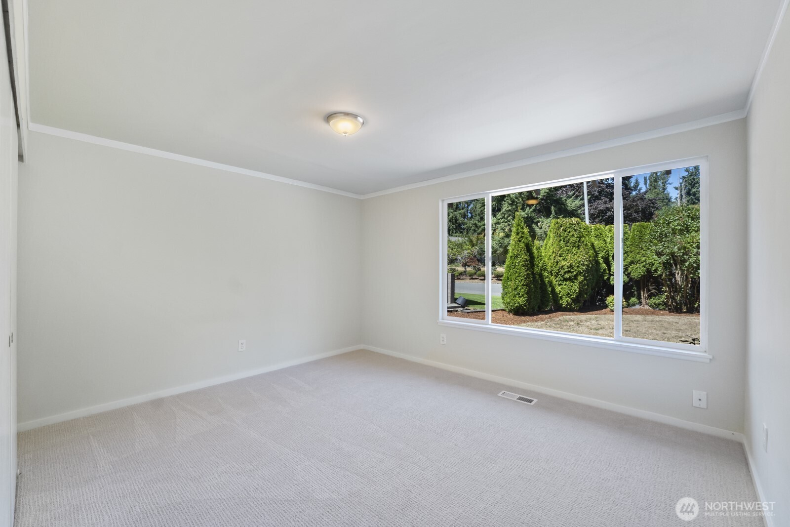 210 219th Place Southwest Bothell, WA 98021 - Photo 13 of 31 an empty room with large windows