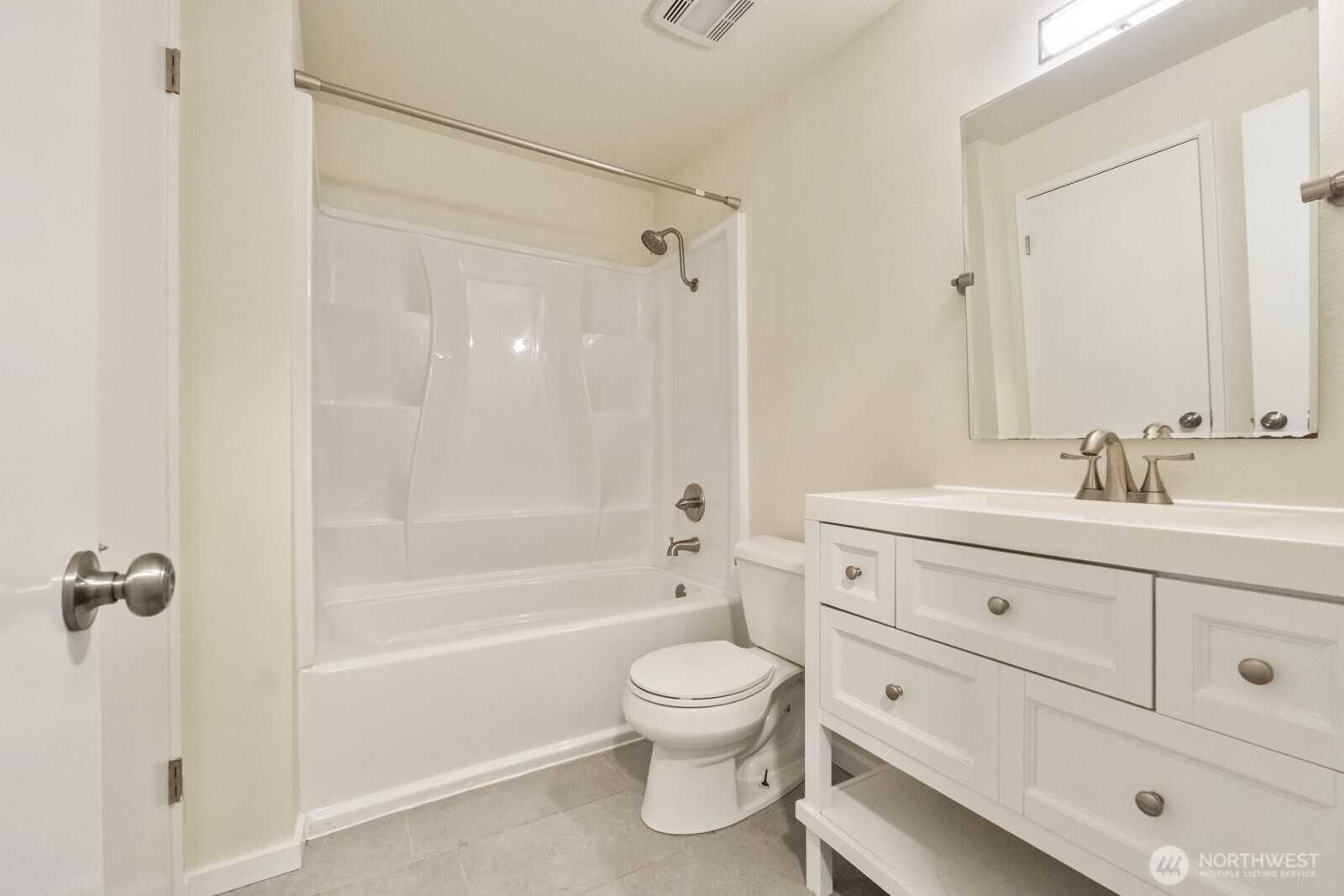 210 219th Place Southwest Bothell, WA 98021 - Photo 15 of 31 a bathroom with a toilet a sink a mirror and shower