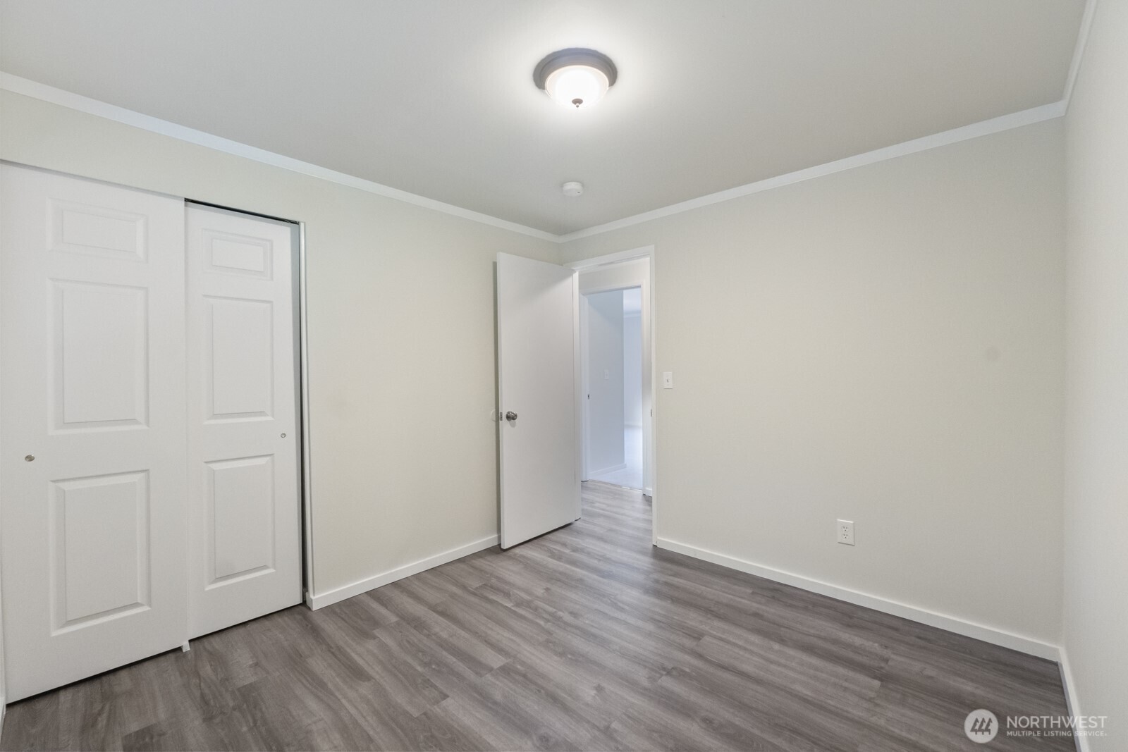 210 219th Place Southwest Bothell, WA 98021 - Photo 17 of 31 a view of an empty room with wooden floor