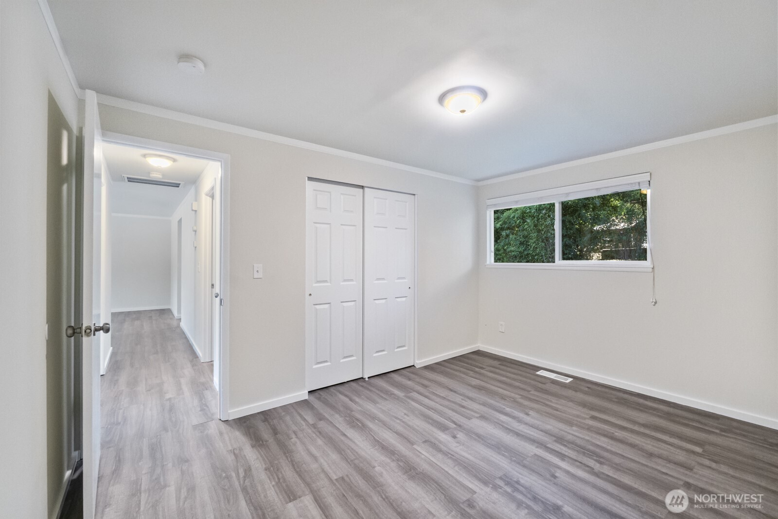 210 219th Place Southwest Bothell, WA 98021 - Photo 19 of 31 an empty room with wooden floor and windows