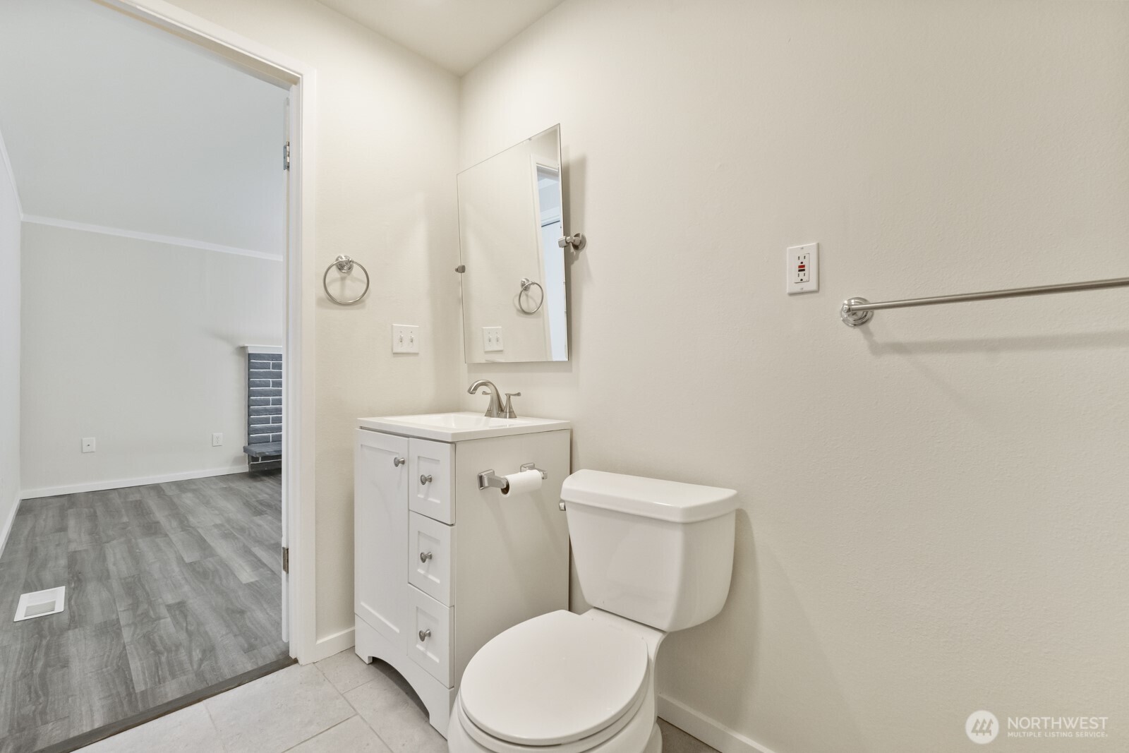 210 219th Place Southwest Bothell, WA 98021 - Photo 21 of 31 a white toilet sitting next to a bathroom sink