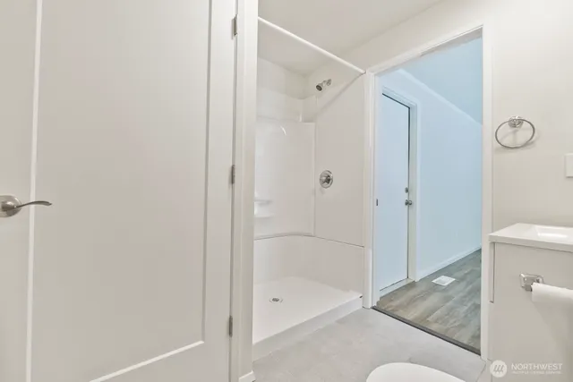 a bathroom with a bathtub and a shower