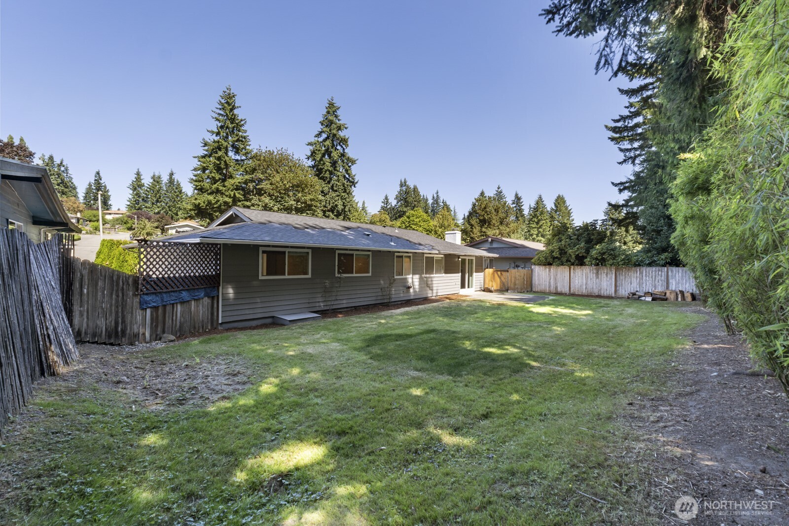 210 219th Place Southwest Bothell, WA 98021 - Photo 24 of 31 a view of a house with backyard and sitting area