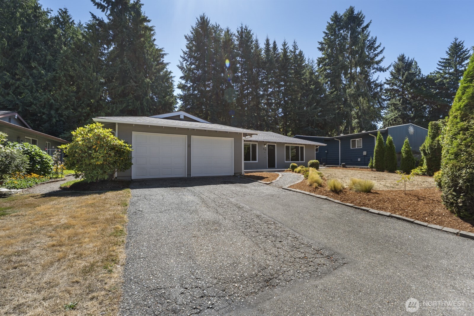 210 219th Place Southwest Bothell, WA 98021 - Photo 29 of 31 a front view of a house with a yard and garage